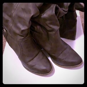 Women’s gray over the knee boot.